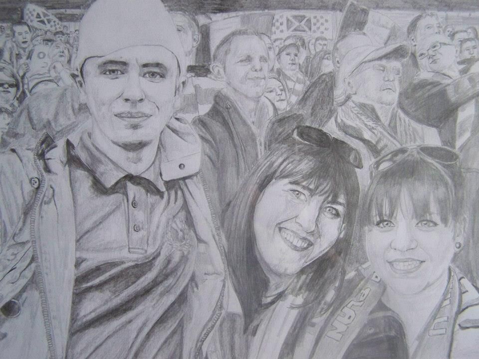 family at football (soccer) match
