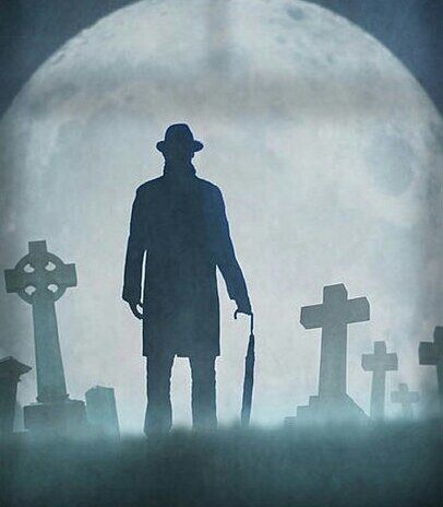 Standing against the greystone...