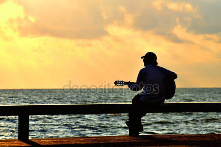 WHILE MY GUITAR PLAYS THE BLUES
