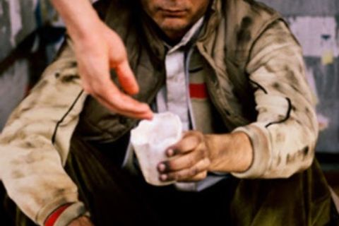 Beggar reads the Jesus Prayer