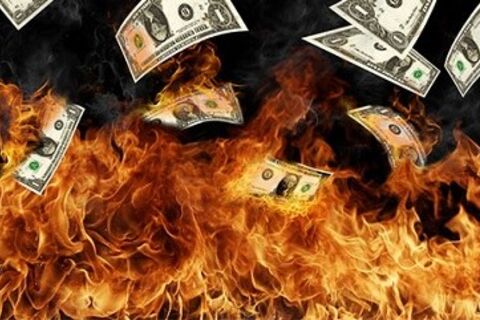 Money turns a burning world.