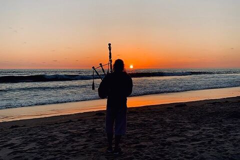 Yon Border Bagpiper on the seashore