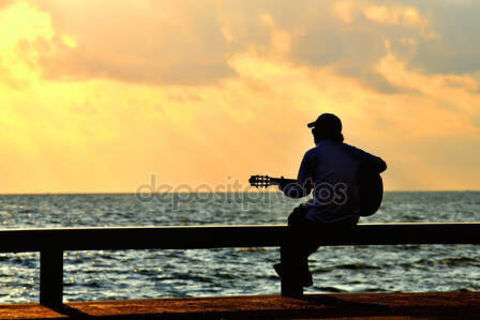 WHILE MY GUITAR PLAYS THE BLUES